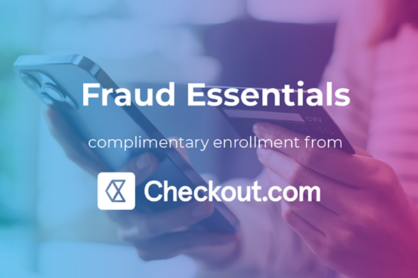 Promotional banner with a person holding a smartphone and credit card. Text reads: 'Fraud Essentials β complimentary enrollment from Checkout.com' with the Checkout.com logo.